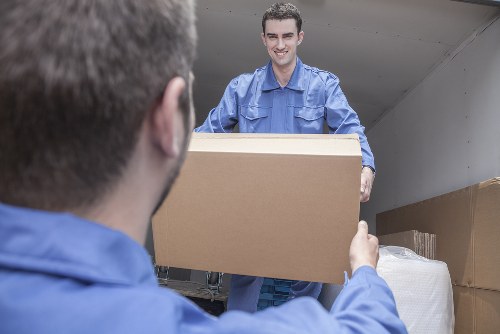 Packed boxes and furniture ready for a man and van removal in Brentford