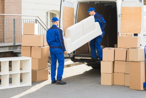 Professional movers handling office furniture in Brentford