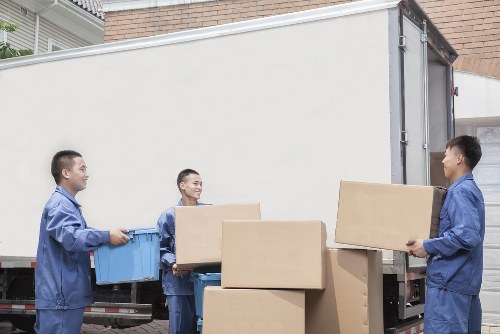 Brentford moving team loading boxes into a van