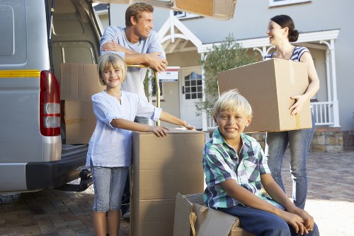 Furniture being carried from a Brentford apartment building